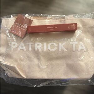 Patrick Ta Cream Canvas makeup bag with handles and Patrick Ta lippie.
